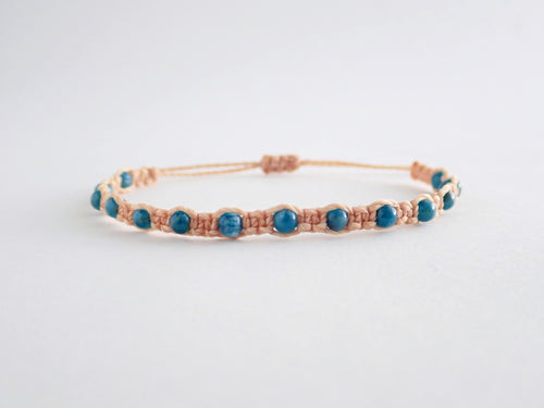 gemini bracelet. star sign bracelet. zodiac bracelet. macrame bracelet in latte coloured string. knotted with 4mm apatite beads. adjustable in size.